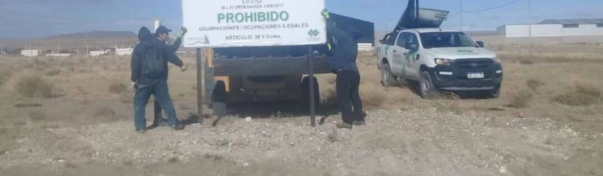 cartel prohibido ocupar tierras